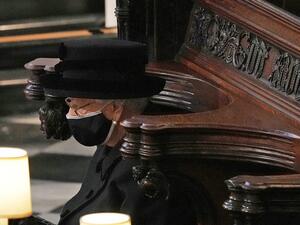 Britain's Queen Elizabeth II sits alone in the quire of St George's Chapel