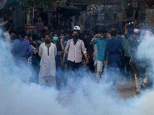 Police fire teargas shell towards supporters of Tehreek-e-Labbaik Pakistan (TLP) party during a protest after their leader was detained following his calls for the expulsion of the French ambassador