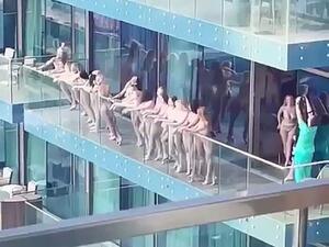 40 Women Pose Naked on a Balcony 