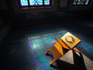 Quran - holy book of muslims, scene in the mosque at Ramadan time