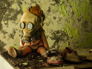 A doll in a gas mask