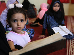 students attend a Quran course