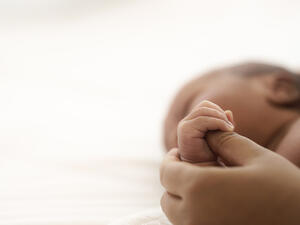 Close up of infant baby hand