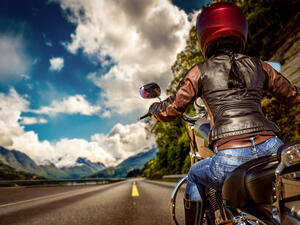 Biker girl rides a motorcycle 