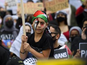 A young demonstrator painted his face with the colors of the Palestine flag as people demonstrate in support of Palestine during the Los Angeles Nakba 73: Resistance Until Liberation rally and protest from the US Federal Building to the Consulate of Israel 