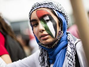A woman attends a protest in support of Palestine in Queens in New York on May 22, 2021. Gazans tried to piece back their lives Saturday after a devastating 11-day conflict with Israel that killed more than 200 people and made thousands homeless in the impoverished Palestinian enclave. US President Joe Biden pledged to help organise efforts to rebuild Gaza and said creating a Palestinian state alongside Israel is the "only answer" to the conflict