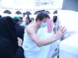 Pakistani PM Imran Khan approaches Ḥajaru al-Aswad set intact into the Kaaba's wall by Prophet Muhammad