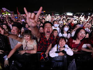 Thousands of revellers bounce and scream with delight at the Strawberry Music Festival in China's Wuhan city