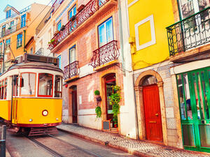 Yellow vintage tram on the street in Lisbon, Portugal