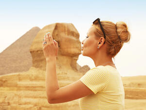 Tourist kissing the Sphinx, Cairo, Egypt
