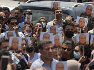 Protesters take part in a demonstration calling for Palestinian president Mahmud Abbas to quit in Ramallah in the occupied West Bank on June 24, 2021, following the death of Palestinian human rights activist Nizar Banat who died shortly after being arrested by Palestinian Authority (PA) security forces. The family of Nizar Banat claimed he was beaten to death, sparking condemnation from human rights activists, marches in the West Bank city of Ramallah, and calls for an inquiry
