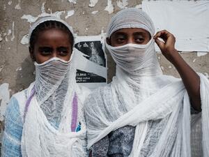 Young Ethiopian Orthodox worshippers watch people dancing and praying for peace at St. Mary church in Mekele, the capital of Tigray region, 