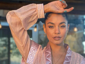 Vanessa Hudgens proudly shows off her 10th tattoo... a boa constrictor along inside of her left ankle