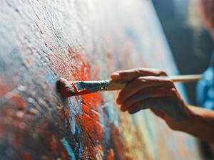 Female Artist Works on Abstract Oil Painting
