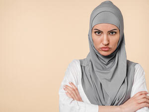 Offended sad angry with negative emotions young middle eastern arabian muslim islamic woman