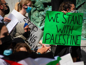 Protesters in a rally with Palestinian flags