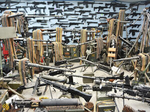  military weapons and artifacts such as these machine guns and weapons