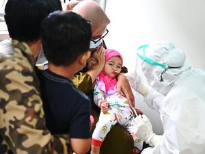 A child is tested for the Covid-19 coronavirus in Banda Aceh on August 13, 2021.
