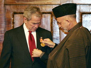 Taliban leader, former Afghan president discuss new government