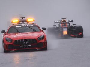 Red Bull's Dutch driver Max Verstappen (R) drives behind the safety car during preliminary laps as the race is postponed over rainy weather during the Formula One Belgian Grand Prix at the Spa-Francorchamps circuit in Spa on August 29, 2021. (Photo: AFP)