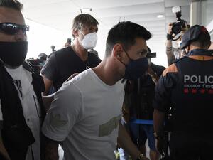 Barcelona's departing Argentinian forward Lionel Messi arrives at El Prat airport in Barcelona on August 10, 2021. France is waiting impatiently for Lionel Messi with supporters gathering outside Paris Saint-Germain's ground hoping to see the Argentine who is expected to join the Qatar-owned club after his exit from Barcelona. (Photo: AFP)