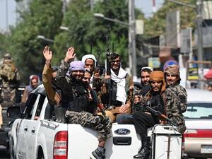 Taliban fighters manned checkpoints around Kabul as work got underway to form a new government in Afghanistan