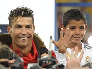 Cristiano Ronaldo celebrates with his son Cristiano junior after winning the UEFA Champions League final football match between Liverpool and Real Madrid at the Olympic Stadium in Kiev, Ukraine on May 26, 2018. (Photo: AFP)