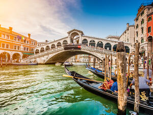 Panoramic view of famous Canal Grande from famous Rialto Bridge at sunset in Venice, Italy