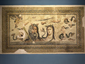 The 2,700-year-old Roman mosaic, depicting two human figures with roosters