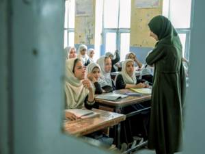 Afghan girls attend a class in a school in Kandahar