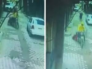 اللص كان يقود دراجة خلال سرقته للفتاة وسحلها في الشارع