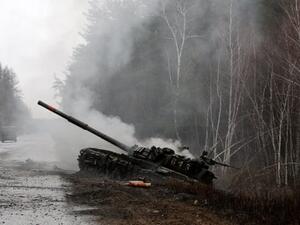 Smoke rises from a Russian tank