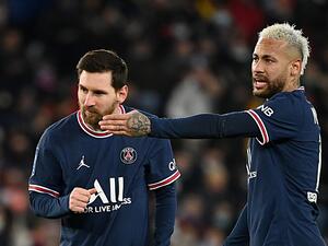 Paris Saint-Germain's Brazilian forward Neymar (R) gestures next to Paris Saint-Germain's Argentinian forward Lionel Messi during the French L1 football match between Paris-Saint Germain (PSG) and Saint-Etienne (ASSE) at The Parc des Princes Stadium in Paris on February 26, 2022. (Photo by FRANCK FIFE / AFP)