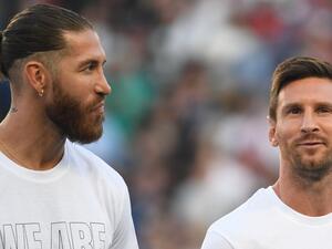 Paris Saint-Germain's Spanish defender Sergio Ramos (L) and Paris Saint-Germain's Argentinian forward Lionel Messi pose during a presentation ceremony prior to the French L1 football match between Paris Saint-Germain and Racing Club Strasbourg at the Parc des Princes stadium in Paris on August 14, 2021. (Photo by Bertrand GUAY / AFP)