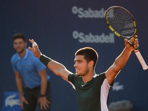 Spain's Carlos Alcaraz celebrates after winning against Spain's Pablo Carreno-Busta during the ATP Barcelona Open tennis tournament singles final match at the Real Club de Tenis in Barcelona on April 24, 2022. (Photo by Josep LAGO / AFP)