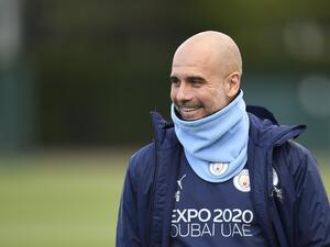 Manchester City's Spanish manager Pep Guardiola reacts as he arrives to lead a training session at the Manchester City training ground in Manchester, north west England, on April 25, 2022, on the eve of their UEFA Champions League semi-final first leg football match against Real Madrid. (Photo by Oli SCARFF / AFP)