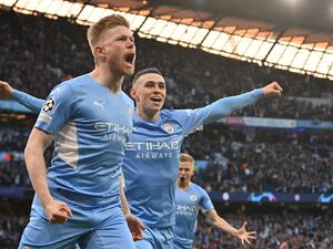 Manchester City's Belgian midfielder Kevin De Bruyne celebrates after scoring a goal during the UEFA Champions League semi-final first leg football match between Manchester City and Real Madrid, at the Etihad Stadium, in Manchester, on April 26, 2022. (Photo by Paul ELLIS / AFP)