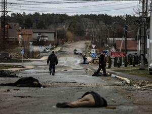 Bodies lie on a street in Bucha
