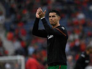 Portugal's forward Cristiano Ronaldo gestures before the start of the World Cup 2022 qualifying final first leg football match between Portugal and North Macedonia at the Dragao stadium in Porto on March 29, 2022. (Photo by MIGUEL RIOPA / AFP)