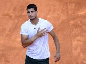 Spain's Carlos Alcaraz celebrates after beating Spain's Rafael Nadal during their 2022 ATP Tour Madrid Open tennis tournament singles quarter-final match at the Caja Magica in Madrid on May 6, 2022. (Photo by OSCAR DEL POZO / AFP)