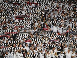 Frankfurt fans raise their scarves during the UEFA Europa League semi-final second leg football match Eintracht Frankfurt v West Ham United in Frankfurt, western Germany on May 5, 2022. (Photo by Christof STACHE / AFP)