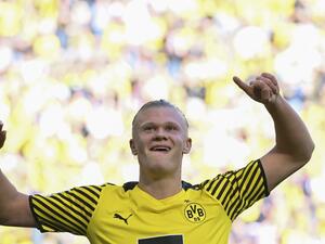 Dortmund's Norwegian forward Erling Braut Haaland celebrates scoring during the German first division Bundesliga football match Borussia Dortmund v VfL Wolfsburg in Dortmund, western Germany. Manchester City said Tuesday, May 10, they had reached an agreement in principle with Borussia Dortmund to sign striker Erling Haaland. (Photo by INA FASSBENDER / AFP)