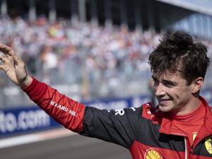 Ferrari's Monegasque driver Charles Leclerc waves to fans after winning the pole position during qualifying for the Miami Formula One Grand Prix at the Miami International Autodrome in Miami Gardens, Florida, on May 7, 2022. (Photo by Brendan Smialowski / POOL / AFP)