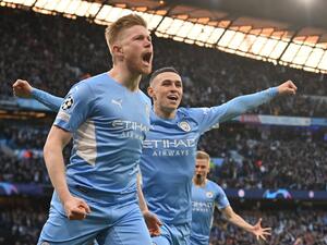 Manchester City's Belgian midfielder Kevin De Bruyne celebrates after scoring a goal during the UEFA Champions League semi-final first leg football match between Manchester City and Real Madrid, at the Etihad Stadium, in Manchester, on April 26, 2022. (Photo by Paul ELLIS / AFP)