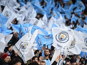 Mancherster City's supporters cheers during the UEFA Champions League semi-final first leg football match between Manchester City and Real Madrid, at the Etihad Stadium, in Manchester, on April 26, 2022. (Photo by Oli SCARFF / AFP)