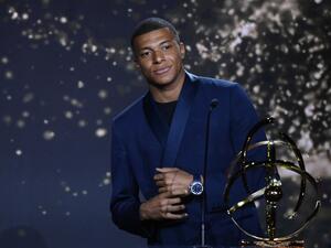 Paris Saint-Germain's French forward Kylian MBappe receives the Best Ligue 1 Player award during the TV show on May 15, 2022 in Paris, as part of the 30th edition of the UNFP (French National Professional Football players Union) trophy ceremony. (Photo by FRANCK FIFE / AFP)