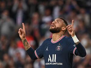 Paris Saint-Germain's Brazilian forward Neymar celebrates after scoring a penalty during the French L1 football match between Paris-Saint Germain (PSG) and ES Troyes AC at The Parc des Princes Stadium in Paris on May 8, 2022. (Photo by Anne-Christine POUJOULAT / AFP)