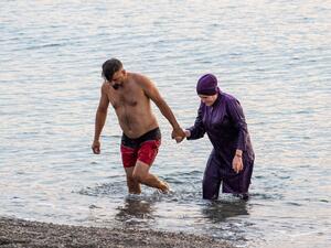 lawmakers in Grenoble, France, voted to allow Muslim women to wear burqini swimsuits at state-run swimming pools