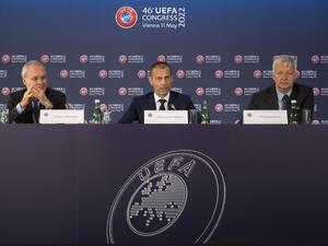 Deputy General Secretary of UEFA, Giorgio Marchetti (left), UEFA president Aleksander Ceferin and Philip Townsend (right) UEFA's managing director of communications, speak during the final press conference at the end of the 46th UEFA Congress and Executive Committee meeting at the Messe Wien Exhibition Congress Center in Vienna, Austria on May 11, 2022. (Photo by JOE KLAMAR / AFP)