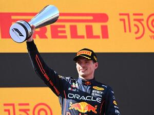 Red Bull's Dutch driver Max Verstappen celebrates on the podium after the Spanish Formula One Grand Prix at the Circuit de Catalunya on May 21, 2022 in Montmelo, on the outskirts of Barcelona. (Photo by GABRIEL BOUYS / AFP)